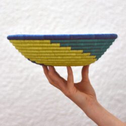 Side view of yellow green and blue swirl patterned basket
