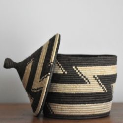 Monochrome woven storage basket with lid with zig zag pattern