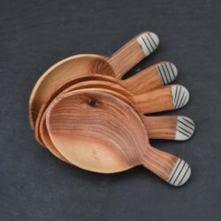 stack of wooden coffee spoons with bone detail