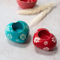 red and blue heart shaped soapstone tea light holders