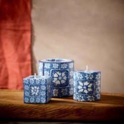 Set of three different sized swazi candles with delft pattern